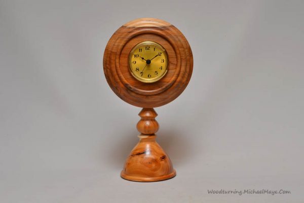 Yew pedestal clock
